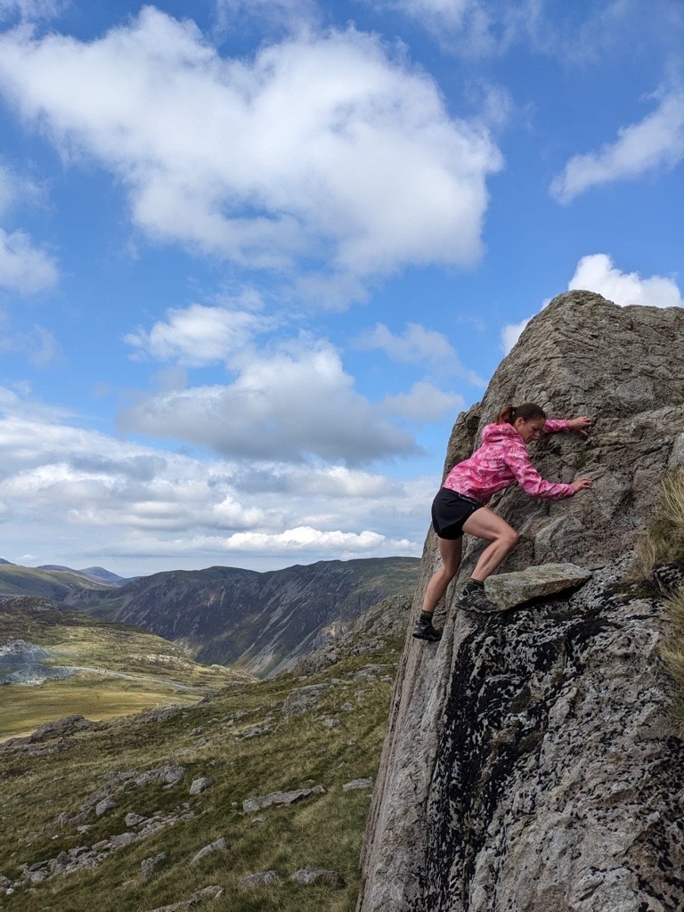 Kate playing on the boulders on Grey Knotts