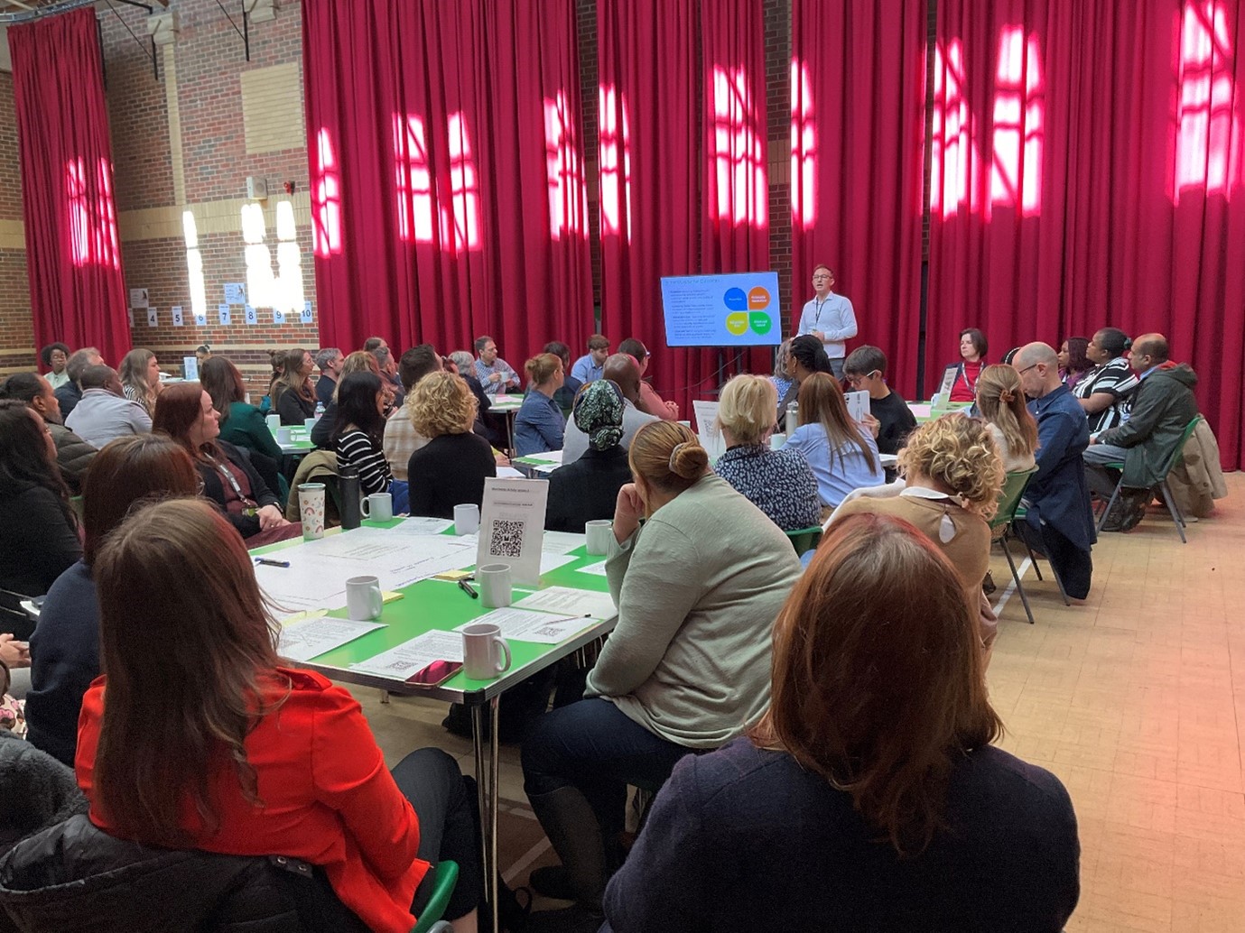 Richard Groves speaking to a room of people 