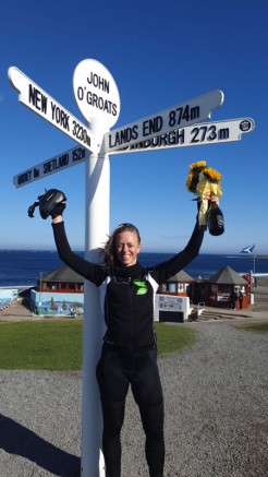 Clare Bull celebrates in John O'Groats after completing her epic cycle ride 