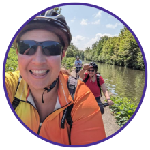 Photo of Nikyla and friends cycling along a canal path